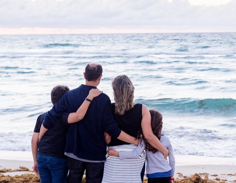a family of four on a beach